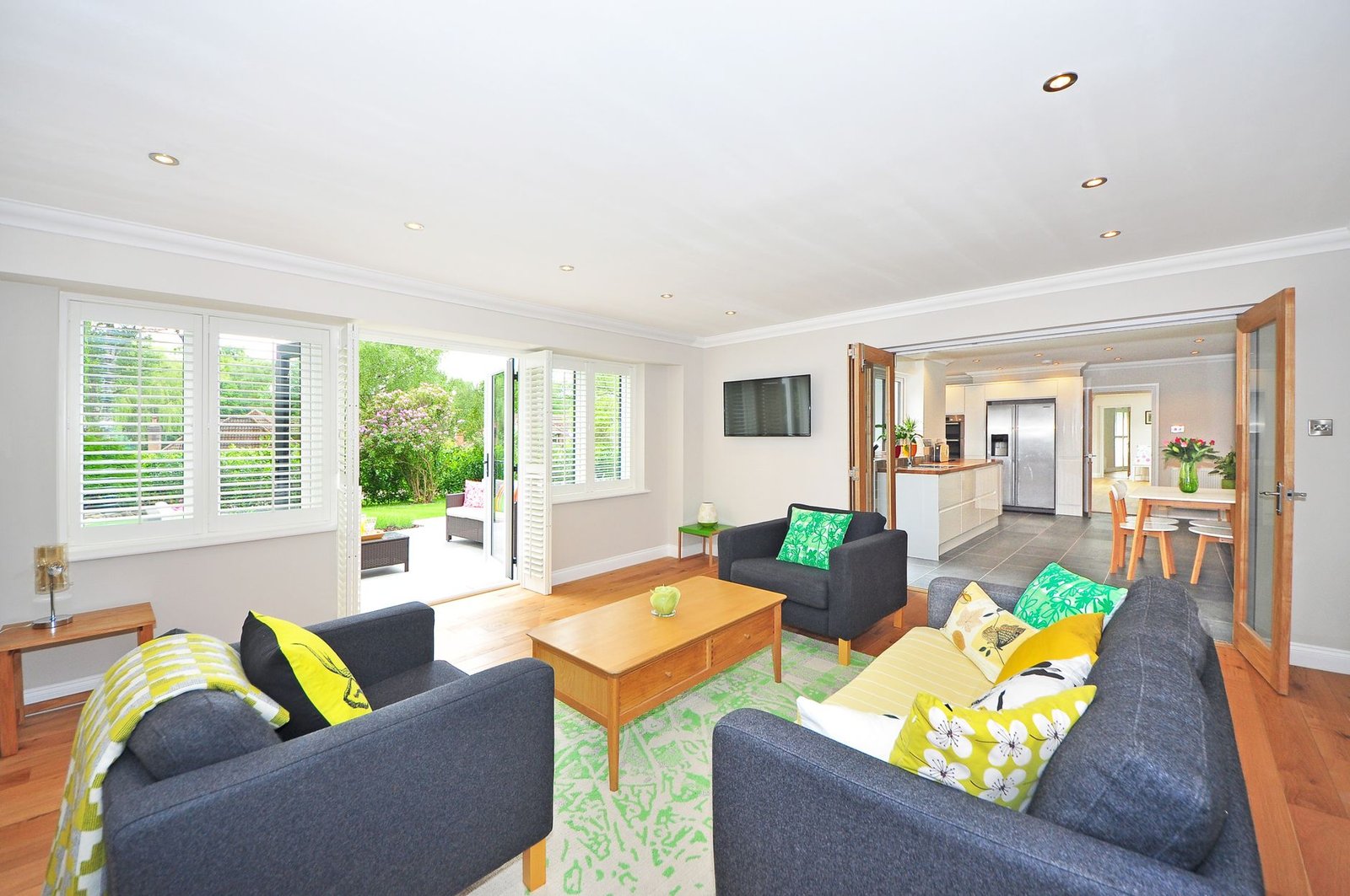 Bright, open-plan living room with garden view